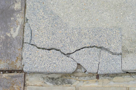 Cement surface cracks on pedestrian walkways. earthquake effectの写真素材