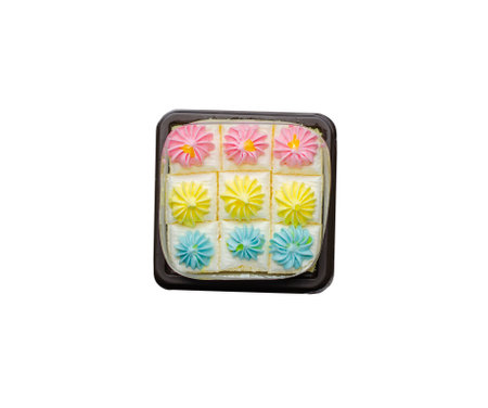 Fresh and delicious bento mini vanilla cupcakes with whipping cream pastel colors. isolated on white...