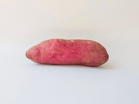 Japanese sweet potato Beni Haruka on white backgroundの写真素材