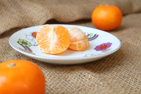 Side view of sliced fresh Oranges fruit on a plate. Fruits contain vitamins. citrus fruitの写真素材