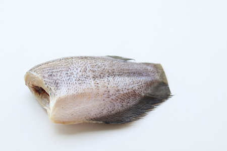 Side view of Freshly cut Snakeskin gourami fish on a white background. use it to make sun dried...