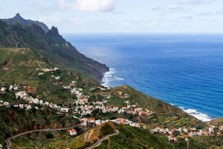 A breathtaking view of the beautiful town of Tagane between mountains and cliffsの写真素材