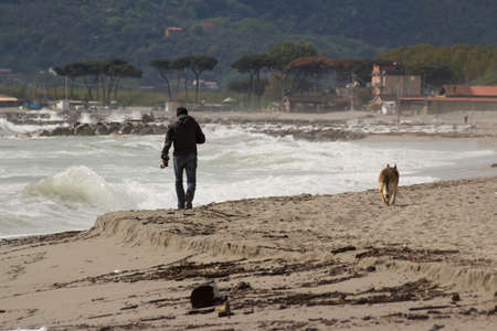 A young man and dog breedの写真素材
