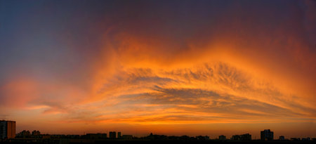 Wide panorama of the sunset, The sky is on fire. Kiss lips shape from clouds. Original form of...
