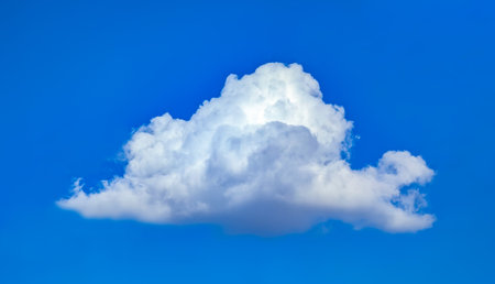 A neat cloud swirls in pairs. A lump of cottony rain in the weather forecast. An approaching thunderstorm stirs its vapors invitingly. A tall cumulus clouds.の写真素材