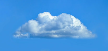 A cumulus cloud isolated against a blue sky. Layered clouds. Cotton fluffy wool texture.