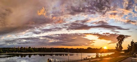 The yellow and orange shadows of sunset clouds. Dramatic high-altitude backdrops of gloomy cloud. A panorama of volumetric light and shadow, immersing the viewer in deep contemplation. Majestic scenery light various shapes calm.の写真素材