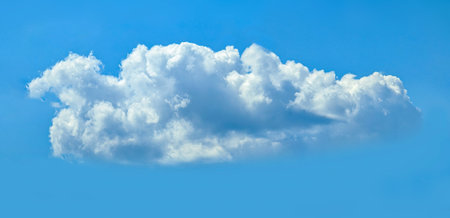 A cumulus cloud isolated against a blue sky. Layered clouds. Cotton fluffy wool texture.