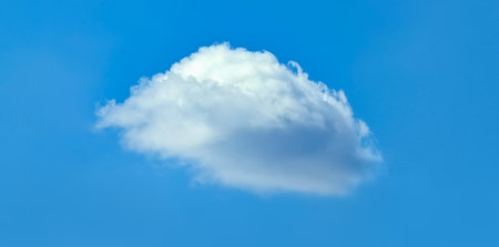 Cloud on sky blue background. An isolated volume of soft steam, distributed into piles and connected...
