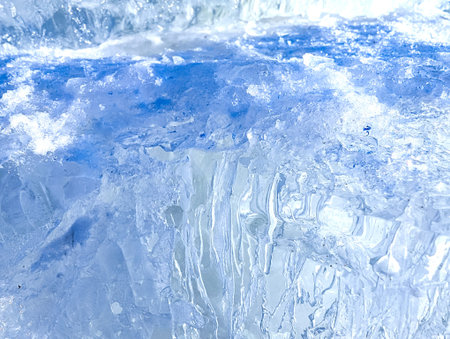 Crystal clear frosty textured natural ice block. The edge of the ice cut off by the cold flood.
