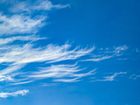 Cirrus horizontal clouds floating across the endless sky. Detailed texture of steam cloud and evaporating moisture. A lone raindrop volumetric soft structure.の写真素材