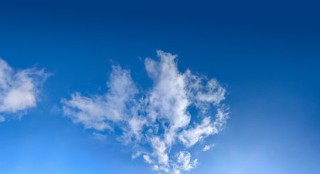 Autumn skies, fish-scale clouds and feather-shaped clouds. The shape of a fan of steam leaving the horizon. Background for wide banner.の写真素材