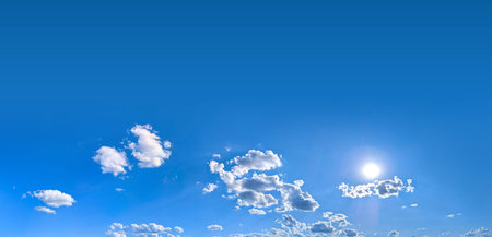 A group of clouds in the form of a wide panorama. Blue background with space for text and a light blue gradient. Violet Sky with Cloud Summer Spring Nature Light on Beautiful Natural sky Backdrop.の写真素材