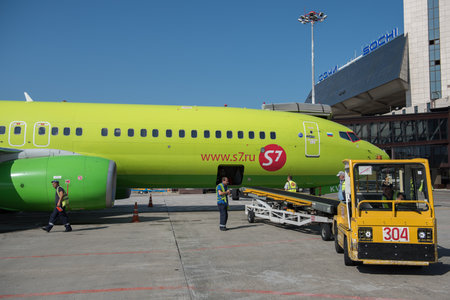 Ground handling of S7Airlines Boeing 737-8ZS aircraft at Sochi International Airport. Ground handling of S7Airlines Boeing 737-8ZS aircraft at Sochi International Airport.のeditorial素材