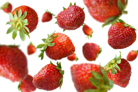 Strawberry levitating on a white backgroundの写真素材