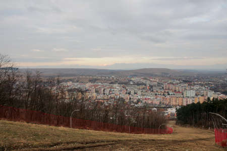 Landscape of city with apartment buildings seen from the hillの写真素材