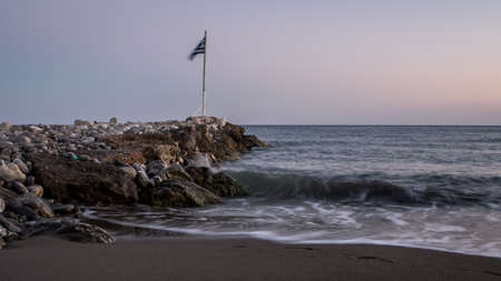 Stone breakwater at sea coast  with seashore and waves in Keratokampos, Creteの写真素材