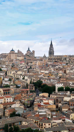 Mesmerizing shot of a beautiful cityscape and ancient Cathedral of Toledo in Spainの写真素材