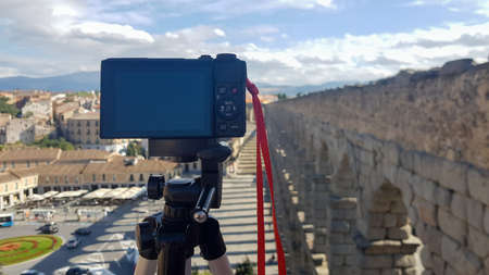 Digital camera taking timelapse at viaduct of Segovia, Spainの写真素材