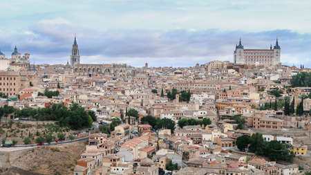 Mesmerizing shot of a beautiful cityscape and ancient Castle and Cathedral of Toledo in Spainのeditorial素材