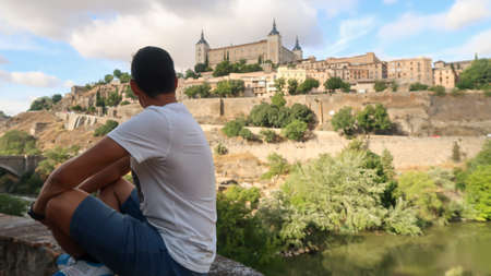 Person looking at the castle of Toledo, Spainのeditorial素材