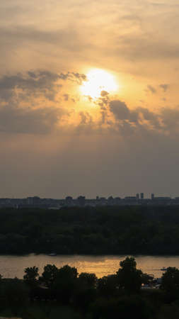 View of beautiful sunset over Zemun, Big War Island and confluense of rivers Danube and Sava, viewed from Kalemegdan fortress in Belgrade, Serbiaの写真素材
