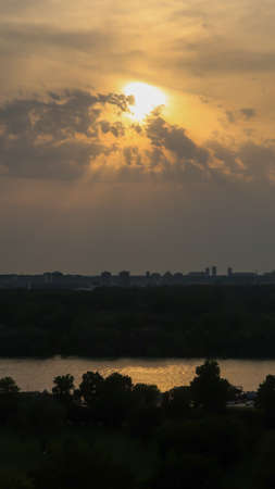 View of beautiful sunset over Zemun, Big War Island and confluense of rivers Danube and Sava, viewed from Kalemegdan fortress in Belgrade, Serbiaの写真素材