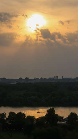 View of beautiful sunset over Zemun, Big War Island and confluense of rivers Danube and Sava, viewed from Kalemegdan fortress in Belgrade, Serbiaの写真素材