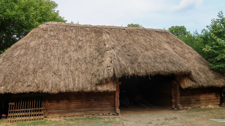 Bucharest, Romania, 10th of August 2021 - Old traditional house in the National Village Museumのeditorial素材