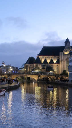 Gent, Belgium, 8th of November 2021 - River channels and buildings during evening. Night life