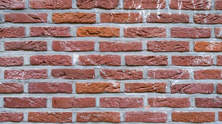 Background of strong red bricks. Texture of brick layersの写真素材