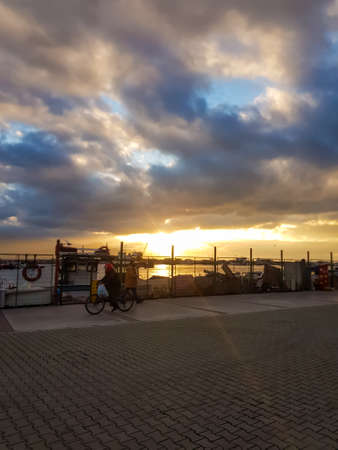 Izmir, Turkey, 5th of January 2022 - Sidewalk at the Aegean Sea during sunset on the coast of Izmir with copy spaceの写真素材