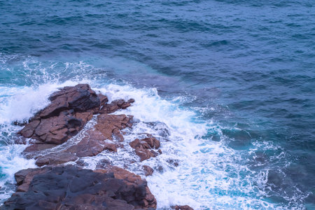 Water of the Atlantic Ocean breaking over rocks - water breaking on rocksの写真素材
