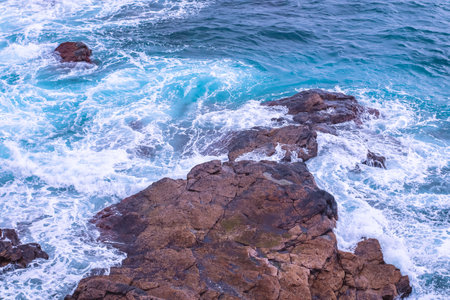 Water of the Atlantic Ocean breaking over rocks - water breaking on rocksの写真素材
