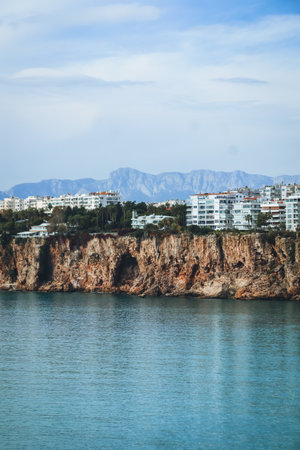 Mediterranean Sea and apartment buildings in the distance seen from Antalya coast, Turkeyの写真素材