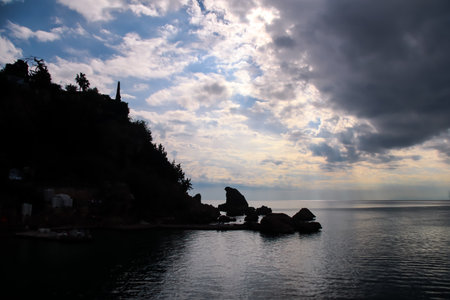 Backlit rocks and cliff during a sunny day in Antalya, Turkeyの写真素材