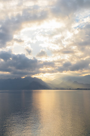 Landscape of Mediterranean sea with mountains in the distance during the sunset, Antalya, Turkeyの写真素材