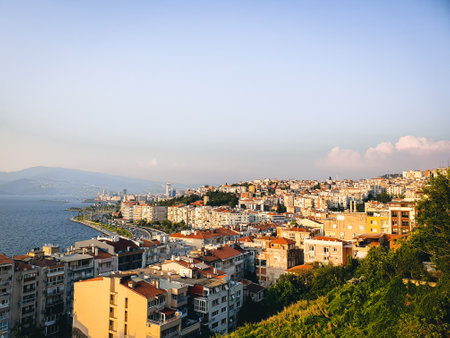 Apartment buildings on the shore of Aegean Sea during the sunset, Izmir, Turkeyの写真素材