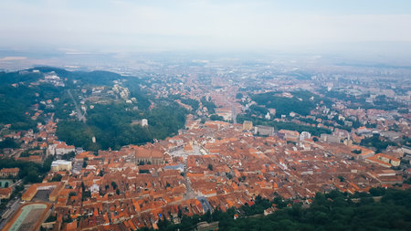 Cityscape view of Brasov, Romania during a foggy cloudy morning, July 2022の写真素材