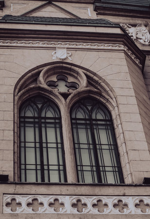 A stunning example of Gothic architecture, featuring an intricate arched window with tracery and ornate stone detailing.の写真素材