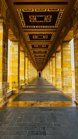 Symmetrical view of the grand travertine colonnade and decorated ceiling at Anitkabir in Ankara, Turkeyの写真素材