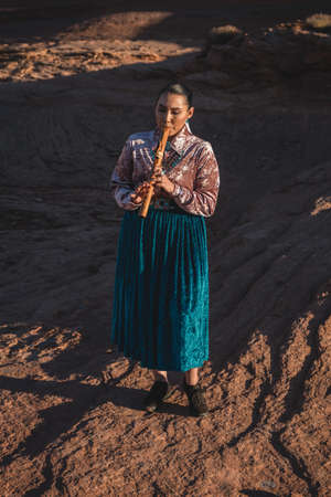 Native American Woman playing Flute in Arizona