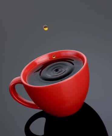 Red Coffee Cup with Drop & Splashの写真素材