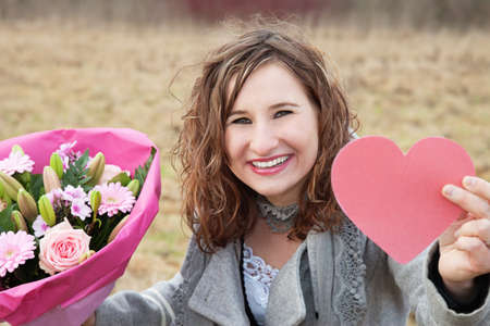 Woman Showing Her Giftsの写真素材