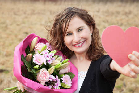 Happy Woman Holding Giftsの写真素材