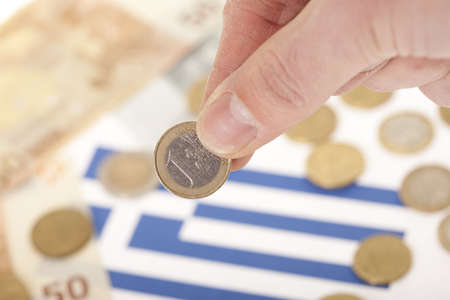 Man investing euro coin to the national economyの写真素材