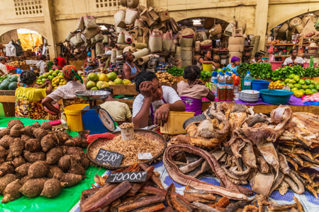 Hell Ville, Nosy Be, Madagascar - December 27, 2016. Women selling their produce at the central market of Hellville