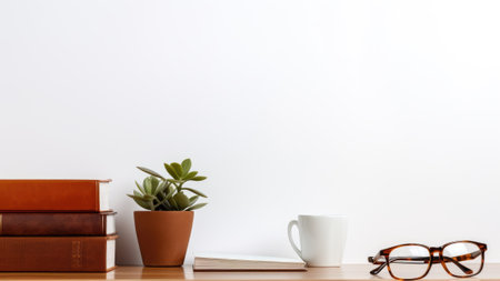 Coffee cup, books, glasses and plant on wooden shelfの素材