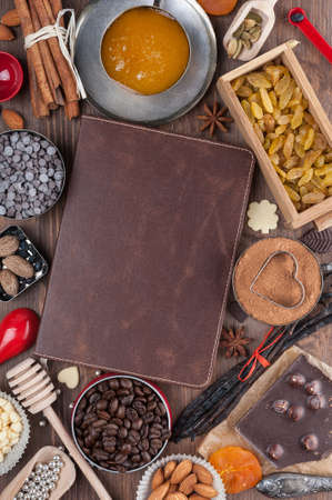 Cover of the book to write prescriptions surrounded ingredients for a sweet holiday bakingの写真素材