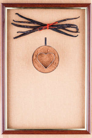 Ð ortrait of a cup with cocoa powder and vanilla beansの写真素材